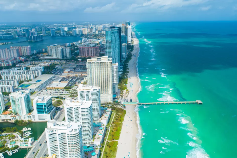 Aerial view of high-rise condominium buildings on beach in Miami, Florida
